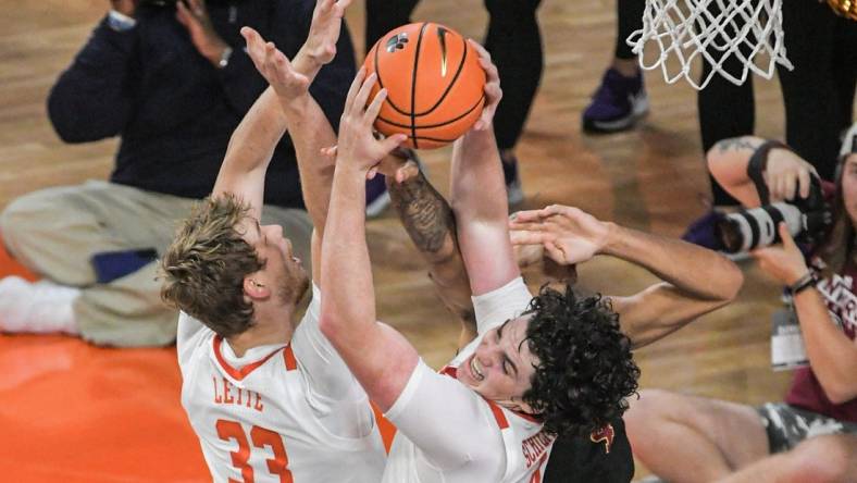 Clemson junior forward Ian Schieffelin (4) rebounds near teammate graduate Bas Leyte (33) during the first half at Littlejohn Coliseum in Clemson, S.C. Monday, November 6, 2023.