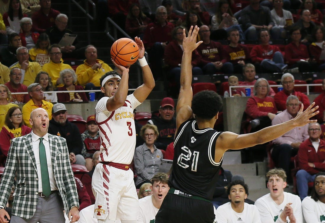 Iowa State Cyclones guard Tamin Lipsey (3) takes a three-point shot over Green Bay Phoenix guard Noah Reynolds (21)during the first half at Hilton Coliseum on Monday, Nov. 6, 2023, in Ames, Iowa.