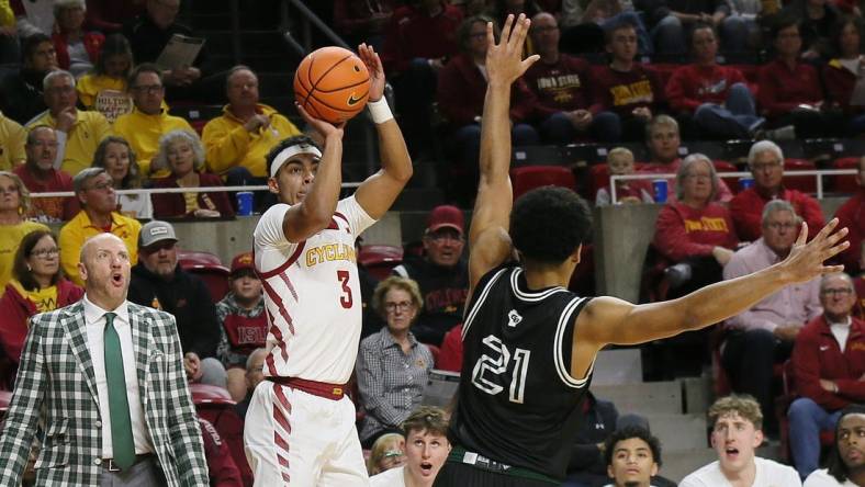 Iowa State Cyclones guard Tamin Lipsey (3) takes a three-point shot over Green Bay Phoenix guard Noah Reynolds (21)during the first half at Hilton Coliseum on Monday, Nov. 6, 2023, in Ames, Iowa.