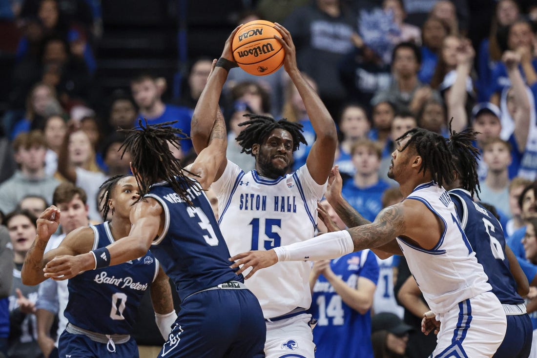 Nov 6, 2023; Newark, New Jersey, USA; Seton Hall Pirates center Jaden Bediako (15) rebounds against St. Peter's Peacocks forward Corey Washington (3) during the first half at Prudential Center. Mandatory Credit: Vincent Carchietta-USA TODAY Sports