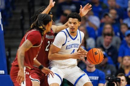 Nov 6, 2023; Lexington, Kentucky, USA; Kentucky Wildcats forward Tre Mitchell (4) handles the ball during the first half against the New Mexico State Aggies at Rupp Arena at Central Bank Center. Mandatory Credit: Jordan Prather-USA TODAY Sports