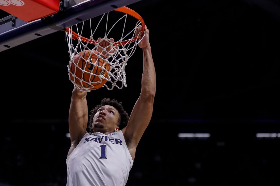 Nov 6, 2023; Cincinnati, Ohio, USA; Xavier Musketeers guard Desmond Claude (1) dunks on the Robert Morris Colonials in the first half at Cintas Center. Mandatory Credit: Katie Stratman-USA TODAY Sports