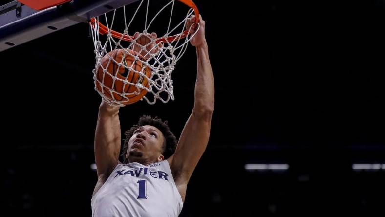 Nov 6, 2023; Cincinnati, Ohio, USA; Xavier Musketeers guard Desmond Claude (1) dunks on the Robert Morris Colonials in the first half at Cintas Center. Mandatory Credit: Katie Stratman-USA TODAY Sports