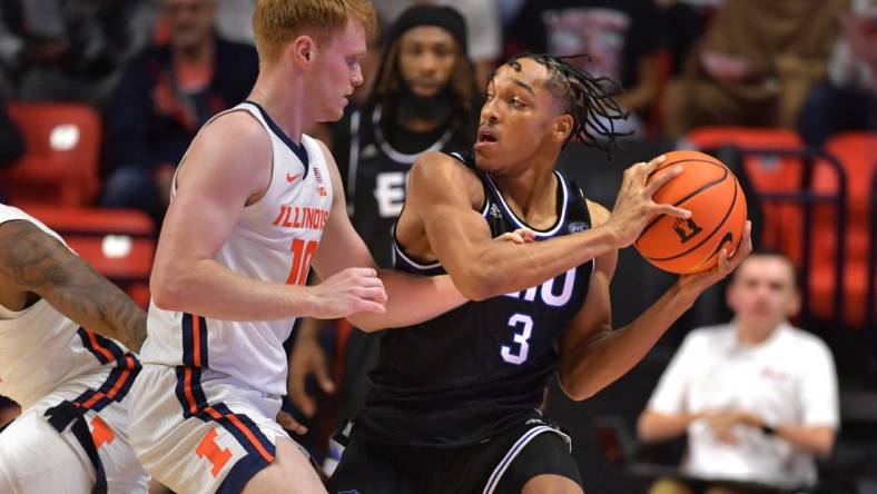 Nov 6, 2023; Champaign, Illinois, USA;  Illinois Fighting Illini guard Luke Goode (10) reaches for the ball controlled by Eastern Illinois Panthers guard Nakyel Shelton (3) during the first half at State Farm Center. Mandatory Credit: Ron Johnson-USA TODAY Sports