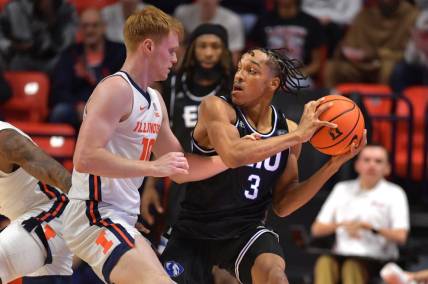 Nov 6, 2023; Champaign, Illinois, USA;  Illinois Fighting Illini guard Luke Goode (10) reaches for the ball controlled by Eastern Illinois Panthers guard Nakyel Shelton (3) during the first half at State Farm Center. Mandatory Credit: Ron Johnson-USA TODAY Sports