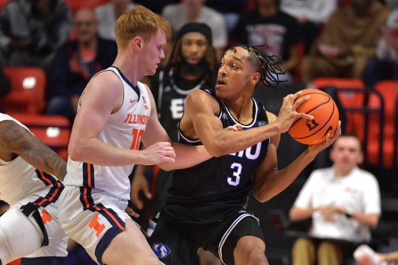 Nov 6, 2023; Champaign, Illinois, USA;  Illinois Fighting Illini guard Luke Goode (10) reaches for the ball controlled by Eastern Illinois Panthers guard Nakyel Shelton (3) during the first half at State Farm Center. Mandatory Credit: Ron Johnson-USA TODAY Sports