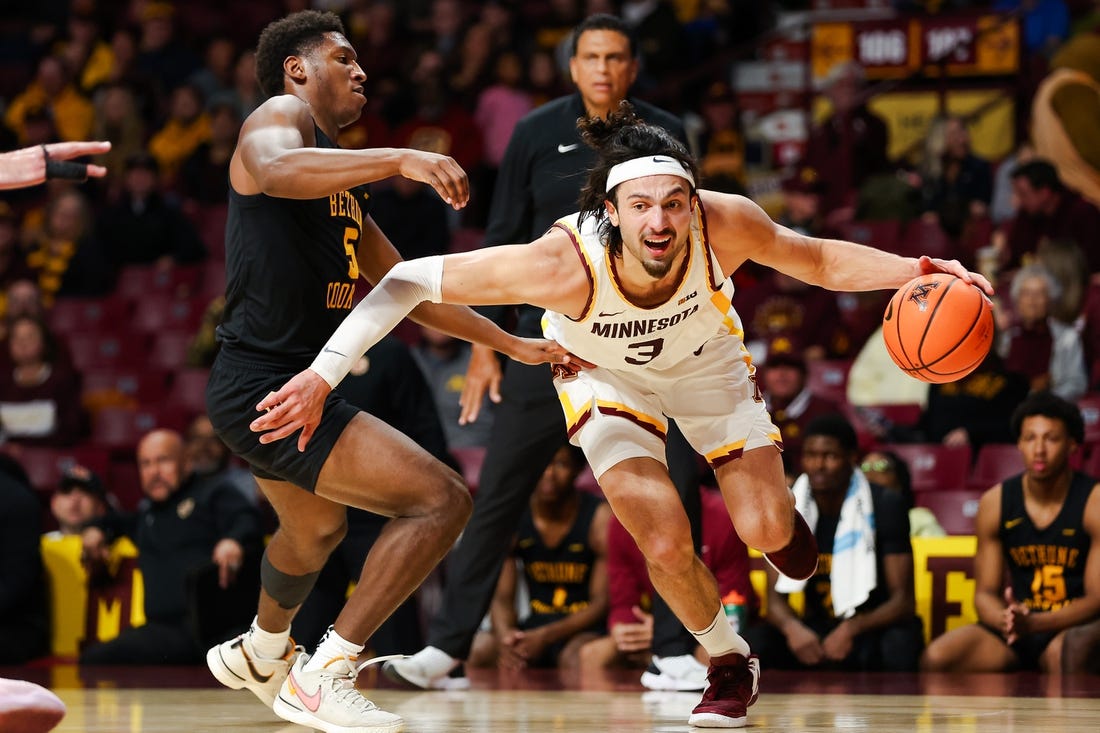 Nov 6, 2023; Minneapolis, Minnesota, USA; Minnesota Golden Gophers forward Dawson Garcia (3) drives around Bethune-Cookman Wildcats guard Damani McEntire (5) during the first half at Williams Arena. Mandatory Credit: Matt Krohn-USA TODAY Sports