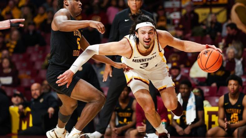 Nov 6, 2023; Minneapolis, Minnesota, USA; Minnesota Golden Gophers forward Dawson Garcia (3) drives around Bethune-Cookman Wildcats guard Damani McEntire (5) during the first half at Williams Arena. Mandatory Credit: Matt Krohn-USA TODAY Sports