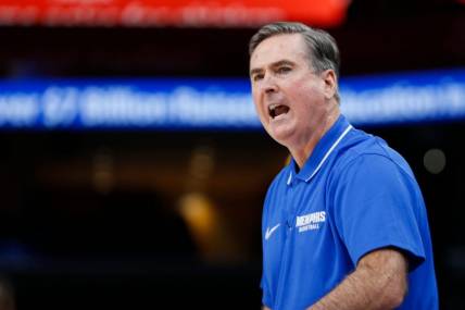 Memphis' assistant coach Rick Stansbury, who is covering for suspended head coach Penny Hardaway, shouts to his players during the season opener between the University of Memphis and Jackson State University at FedExForum in Memphis, Tenn., on Monday, November 6, 2023.