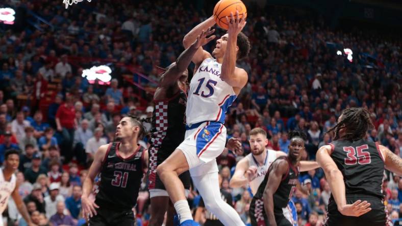 Kansas graduate senior guard Kevin McCullar Jr. (15) drives the ball against North Carolina Central during the first half of Monday's game inside Allen Fieldhouse.