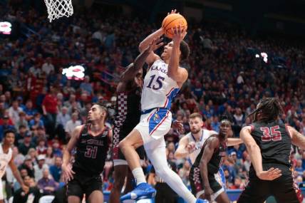 Kansas graduate senior guard Kevin McCullar Jr. (15) drives the ball against North Carolina Central during the first half of Monday's game inside Allen Fieldhouse.