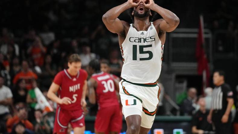 Nov 6, 2023; Coral Gables, Florida, USA; Miami (Fl) Hurricanes forward Norchad Omier (15) reacts to his team scoring in transition against the N.J.I.T Highlanders  in the second half at Watsco Center. Mandatory Credit: Jim Rassol-USA TODAY Sports