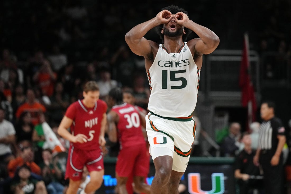 Nov 6, 2023; Coral Gables, Florida, USA; Miami (Fl) Hurricanes forward Norchad Omier (15) reacts to his team scoring in transition against the N.J.I.T Highlanders  in the second half at Watsco Center. Mandatory Credit: Jim Rassol-USA TODAY Sports