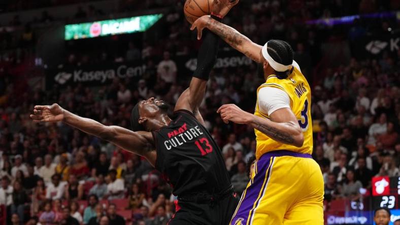 Nov 6, 2023; Miami, Florida, USA; Los Angeles Lakers forward Anthony Davis (3) fouls Miami Heat center Bam Adebayo (13) during the first half at Kaseya Center. Mandatory Credit: Jasen Vinlove-USA TODAY Sports