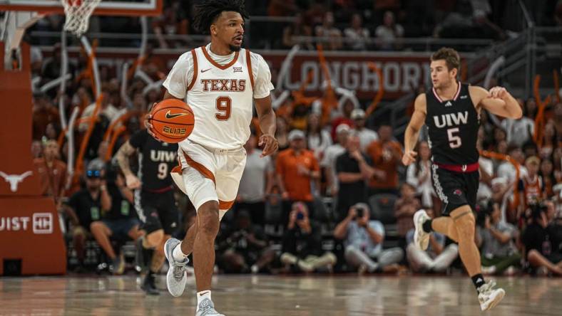 Texas Longhorns guard Ithiel Horton (9) dribbles the ball towards the University of the Incarnate Word basket during the men   s basketball game at the Moody Center on Monday, Nov. 6, 2023 in Austin.