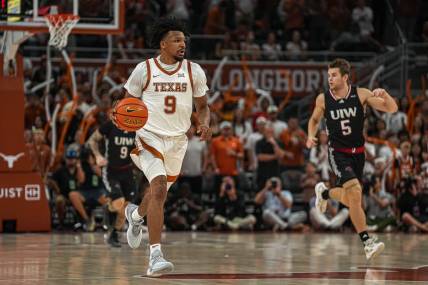 Texas Longhorns guard Ithiel Horton (9) dribbles the ball towards the University of the Incarnate Word basket during the men   s basketball game at the Moody Center on Monday, Nov. 6, 2023 in Austin.