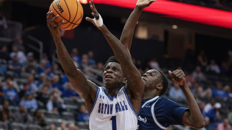 Nov 6, 2023; Newark, New Jersey, USA; Seton Hall Pirates guard Kadary Richmond (1) drives to the basket as St. Peter's Peacocks forward Mouhamed Sow (35) defends during the second half at Prudential Center. Mandatory Credit: Vincent Carchietta-USA TODAY Sports