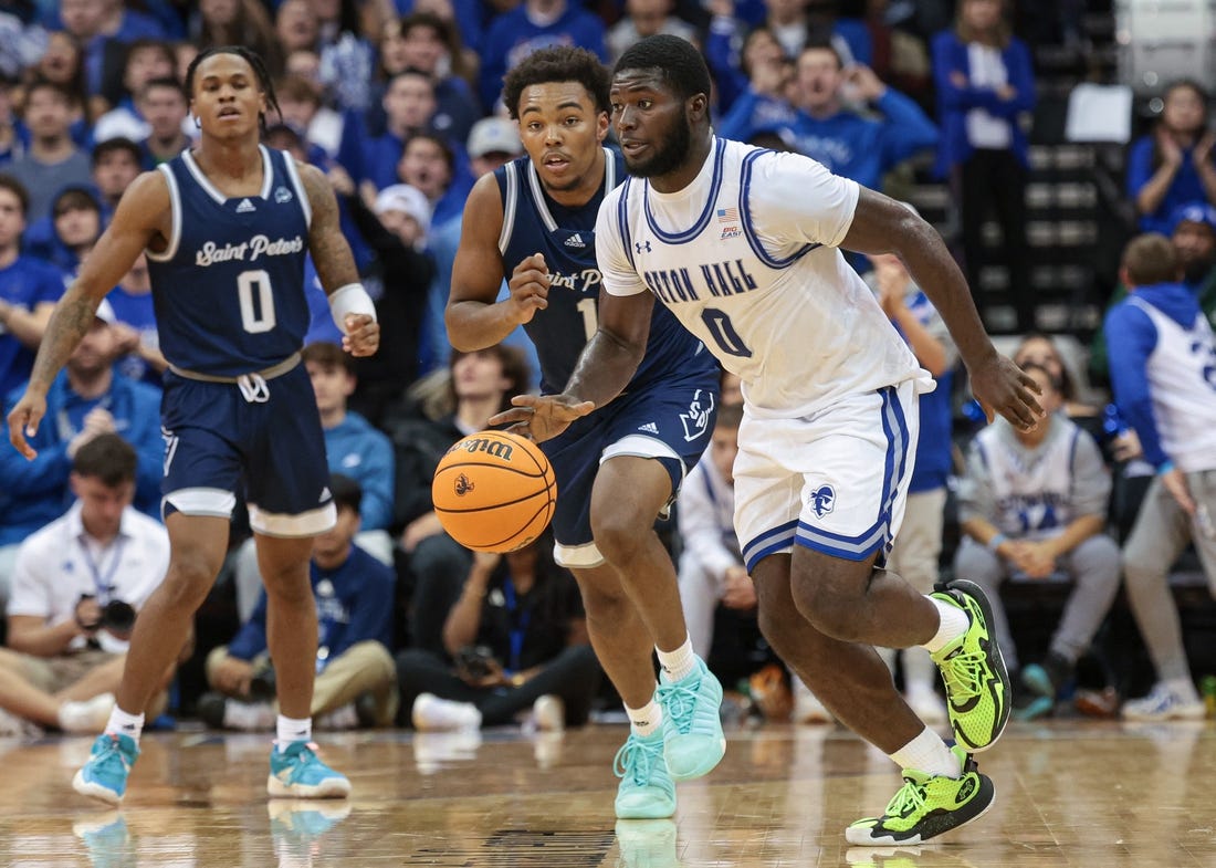 Nov 6, 2023; Newark, New Jersey, USA; Seton Hall Pirates guard Dylan Addae-Wusu (0) dribbles in front of St. Peter's Peacocks guard Brent Bland (1) and guard Latrell Reid (0) during the second half at Prudential Center. Mandatory Credit: Vincent Carchietta-USA TODAY Sports