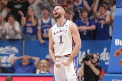 Kansas senior center Hunter Dickinson (1) reacts after sinking a three in the first half of Monday's game against North Carolina Central inside Allen Fieldhouse.