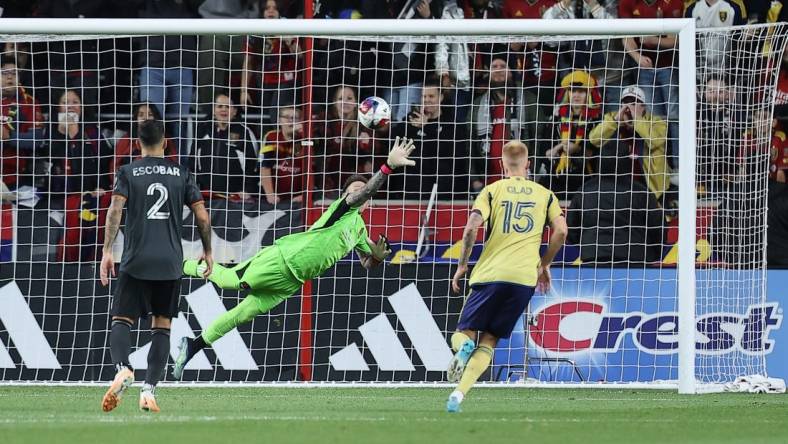 Nov 6, 2023; Sandy, Utah, USA; Houston Dynamo goalkeeper Steve Clark (12) allows a goal scored by Real Salt Lake forward Jefferson Savarino (10) during the second half  at America First Field. Mandatory Credit: Rob Gray-USA TODAY Sports