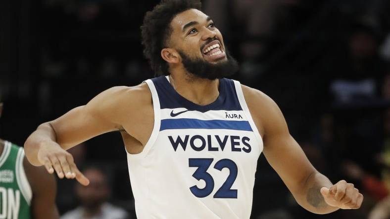 Nov 6, 2023; Minneapolis, Minnesota, USA; Minnesota Timberwolves center Karl-Anthony Towns (32) reacts to fouling out of the game against Boston Celtics in overtime at Target Center. Mandatory Credit: Bruce Kluckhohn-USA TODAY Sports
