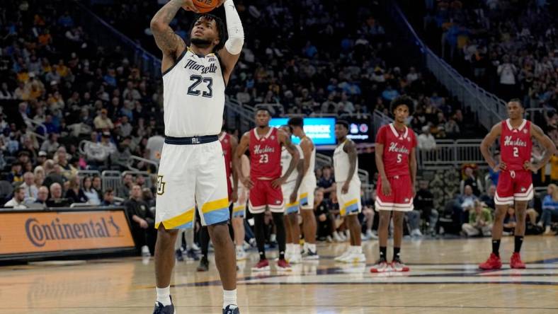 Nov 6, 2023; Milwaukee, Wisconsin, USA; Marquette forward David Joplin (23) shoots a free throw after a flagrant foul during the first half of their game against Northern Illinois  at Fiserv Forum. Mandatory Credit: Mark Hoffman-USA TODAY Sports