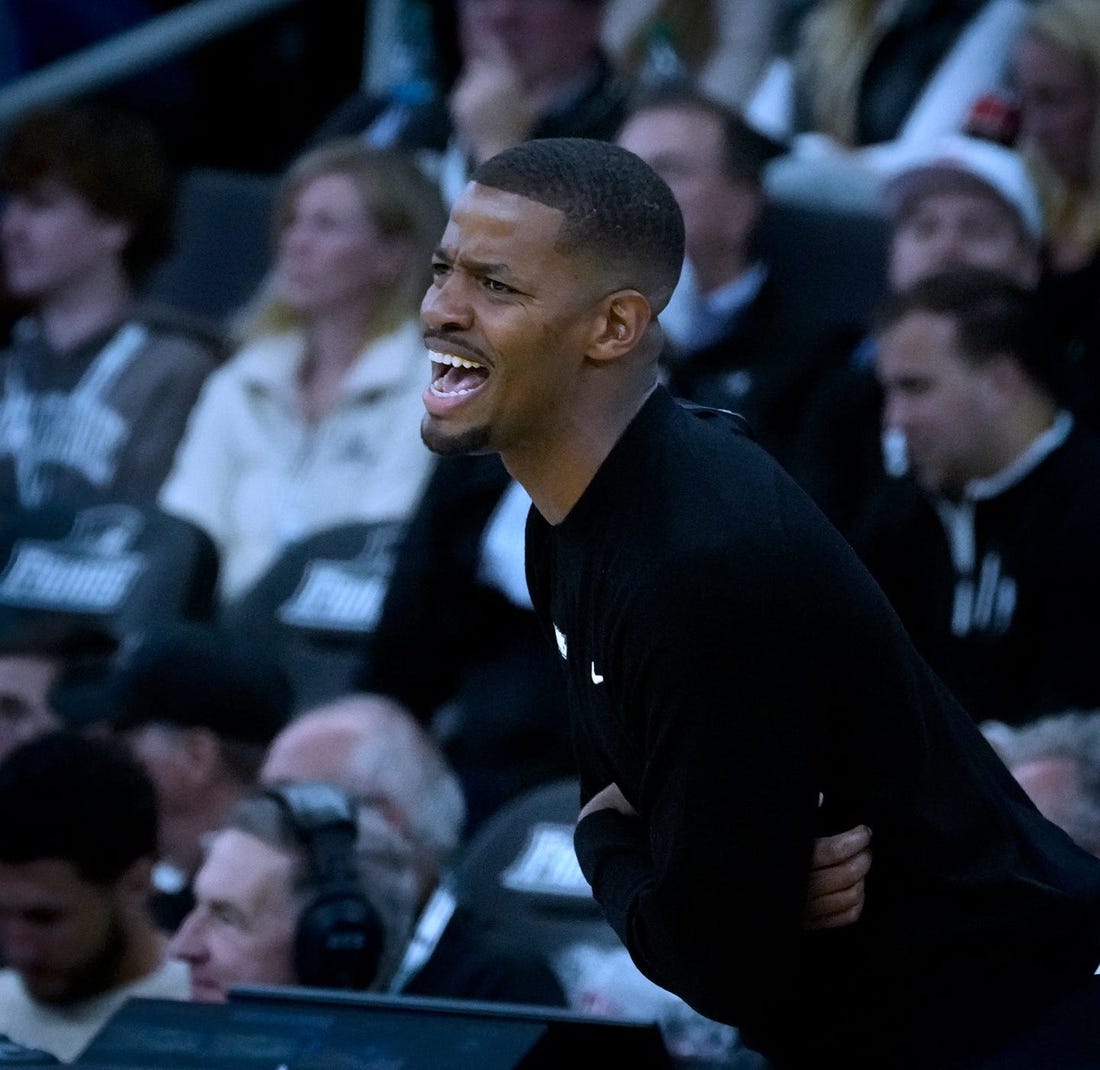 Friars coach Kim English guiding his team from the sidelines.