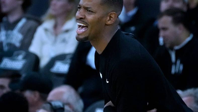 Friars coach Kim English guiding his team from the sidelines.