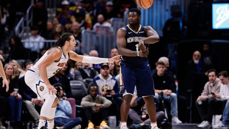 Nov 6, 2023; Denver, Colorado, USA; New Orleans Pelicans forward Zion Williamson (1) passes the ball as Denver Nuggets forward Aaron Gordon (50) guards in the fourth quarter at Ball Arena. Mandatory Credit: Isaiah J. Downing-USA TODAY Sports