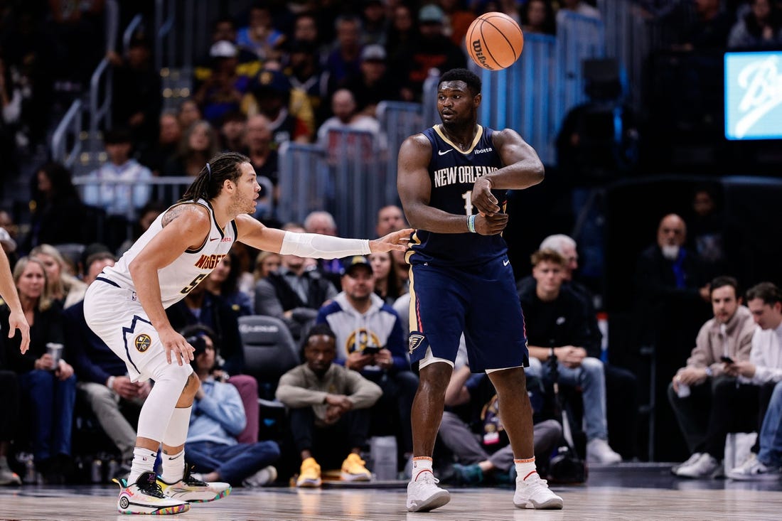 Nov 6, 2023; Denver, Colorado, USA; New Orleans Pelicans forward Zion Williamson (1) passes the ball as Denver Nuggets forward Aaron Gordon (50) guards in the fourth quarter at Ball Arena. Mandatory Credit: Isaiah J. Downing-USA TODAY Sports