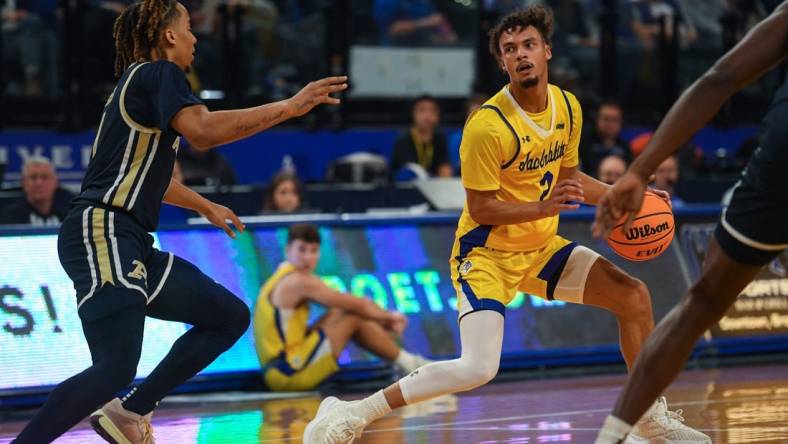 SDSU   s guard Zeke Mayo (2) looks for an opening to pass the ball during a game against Akron on Monday, Nov. 6, 2023 at Frost Arena in Brookings, South Dakota.