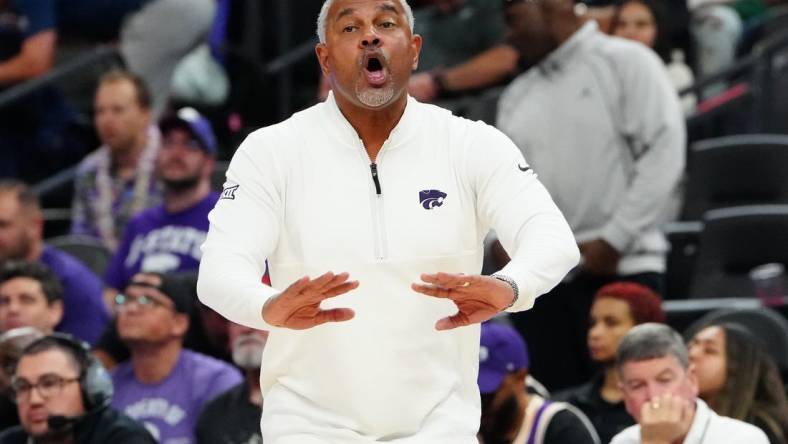 Nov 6, 2023; Las Vegas, Nevada, USA; Kansas State Wildcats head coach Jerome Tang talks to a player before the USC Trojans inbound the ball during the second half at T-Mobile Arena. Mandatory Credit: Stephen R. Sylvanie-USA TODAY Sports