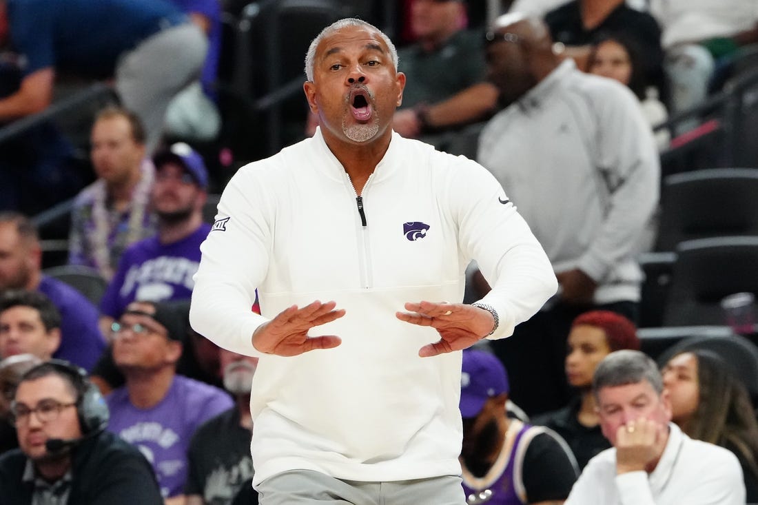 Nov 6, 2023; Las Vegas, Nevada, USA; Kansas State Wildcats head coach Jerome Tang talks to a player before the USC Trojans inbound the ball during the second half at T-Mobile Arena. Mandatory Credit: Stephen R. Sylvanie-USA TODAY Sports