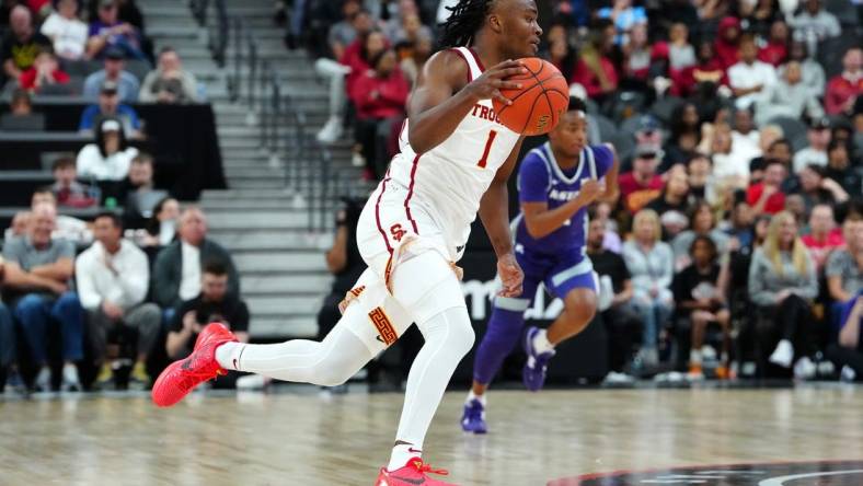 Nov 6, 2023; Las Vegas, Nevada, USA; USC Trojans guard Isaiah Collier (1) dribbles against the Kansas State Wildcats during the first half at T-Mobile Arena. Mandatory Credit: Stephen R. Sylvanie-USA TODAY Sports