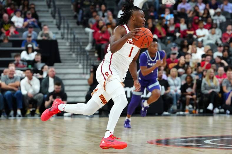 Nov 6, 2023; Las Vegas, Nevada, USA; USC Trojans guard Isaiah Collier (1) dribbles against the Kansas State Wildcats during the first half at T-Mobile Arena. Mandatory Credit: Stephen R. Sylvanie-USA TODAY Sports