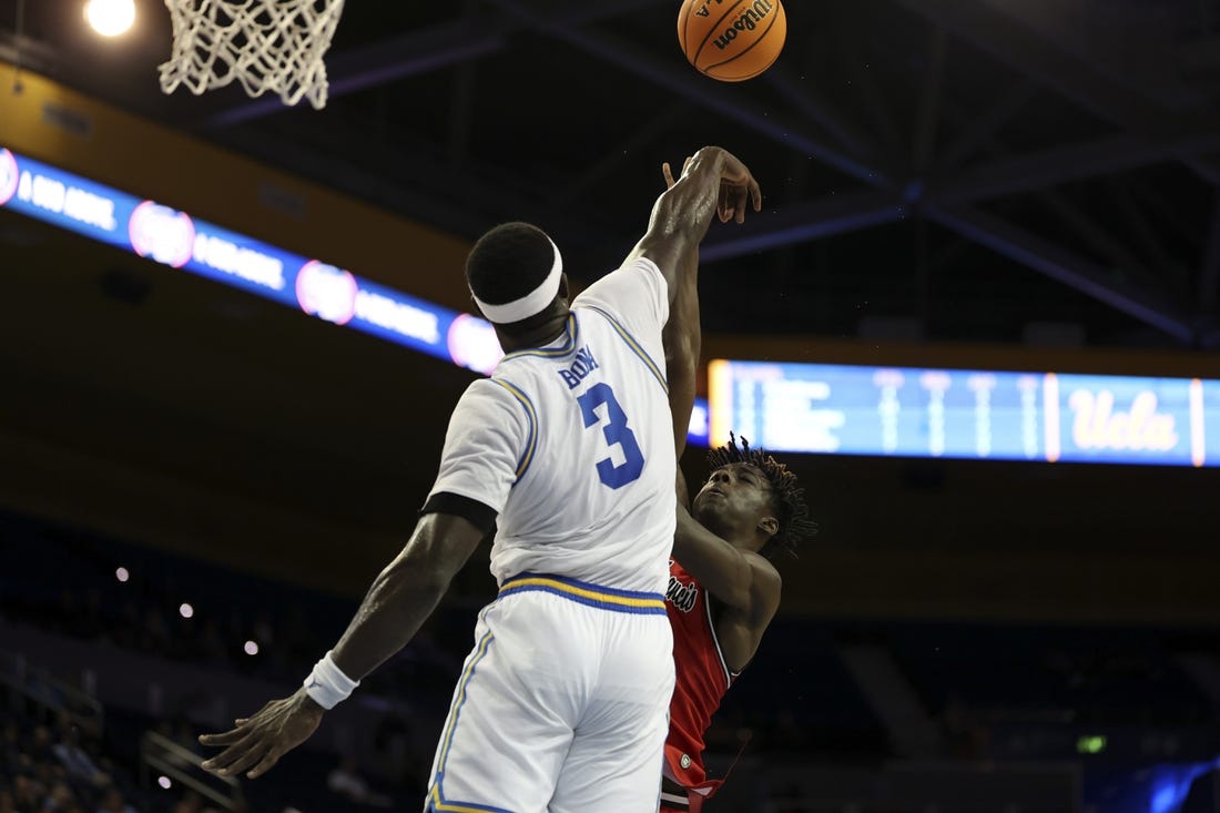 Nov 6, 2023; Los Angeles, California, USA;  UCLA Bruins forward Adem Bona (3) blocks a shot by St. Francis (Pa) Red Flash forward Miles Webb (3) during the second half at Pauley Pavilion presented by Wescom. Mandatory Credit: Kiyoshi Mio-USA TODAY Sports