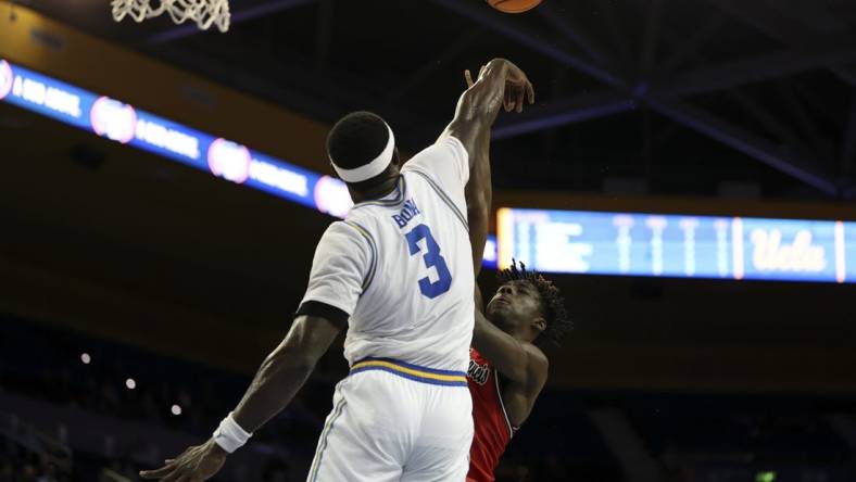 Nov 6, 2023; Los Angeles, California, USA;  UCLA Bruins forward Adem Bona (3) blocks a shot by St. Francis (Pa) Red Flash forward Miles Webb (3) during the second half at Pauley Pavilion presented by Wescom. Mandatory Credit: Kiyoshi Mio-USA TODAY Sports