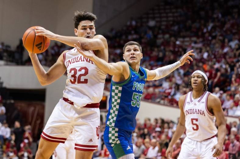 Nov 7, 2023; Bloomington, Indiana, USA; Indiana Hoosiers guard Trey Galloway (32) shoots against Florida Gulf Coast Eagles guard Chase Johnston (55) in the first half at Simon Skjodt Assembly Hall. Mandatory Credit: Trevor Ruszkowski-USA TODAY Sports