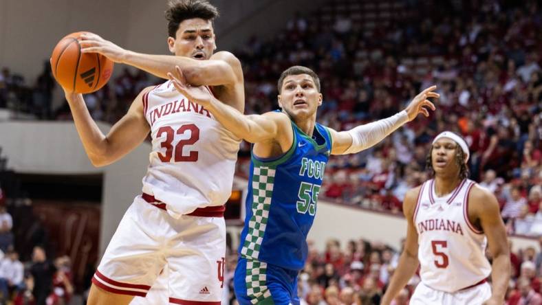 Nov 7, 2023; Bloomington, Indiana, USA; Indiana Hoosiers guard Trey Galloway (32) shoots against Florida Gulf Coast Eagles guard Chase Johnston (55) in the first half at Simon Skjodt Assembly Hall. Mandatory Credit: Trevor Ruszkowski-USA TODAY Sports