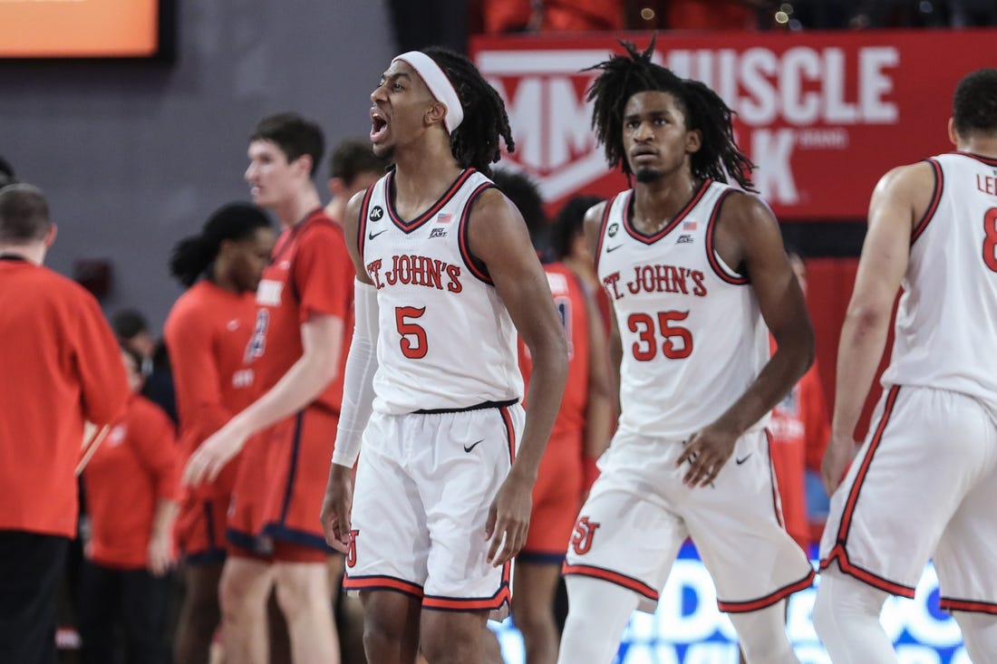 Nov 7, 2023; Queens, New York, USA; St. John's Red Storm guard Daniss Jenkins (5) celebrates with his teammates after a timeout is called by the Stony Brook Seawolves in the first half at Carnesecca Arena. Mandatory Credit: Wendell Cruz-USA TODAY Sports