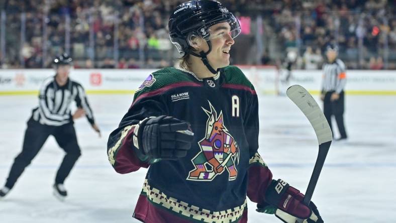 Nov 7, 2023; Tempe, Arizona, USA; Arizona Coyotes right wing Clayton Keller (9) celebrates after scoring a goal in the second period against the Seattle Kraken at Mullett Arena. Mandatory Credit: Matt Kartozian-USA TODAY Sports