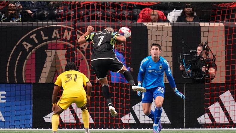 Nov 7, 2023; Atlanta, Georgia, USA; Atlanta United forward Giorgos Giakoumakis (7) scores a goal against Columbus Crew goalkeeper Diego Rossi (28) in the first half at Mercedes-Benz Stadium. Mandatory Credit: Brett Davis -USA TODAY Sports