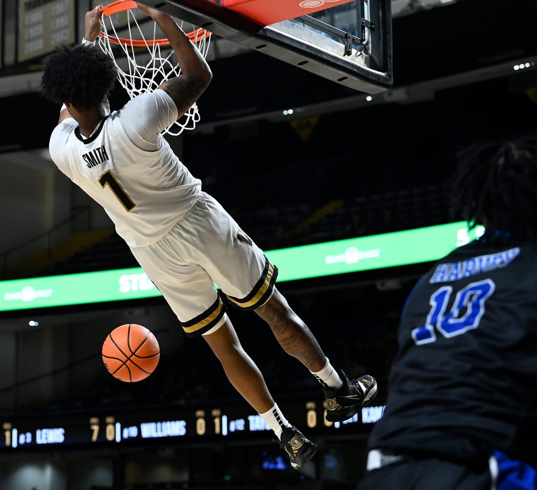 Vanderbilt forward Colin Smith (1) dunks the ball against Presbyterian during the first half of an NCAA college basketball game Tuesday, Nov. 7, 2023, in Nashville, Tenn.