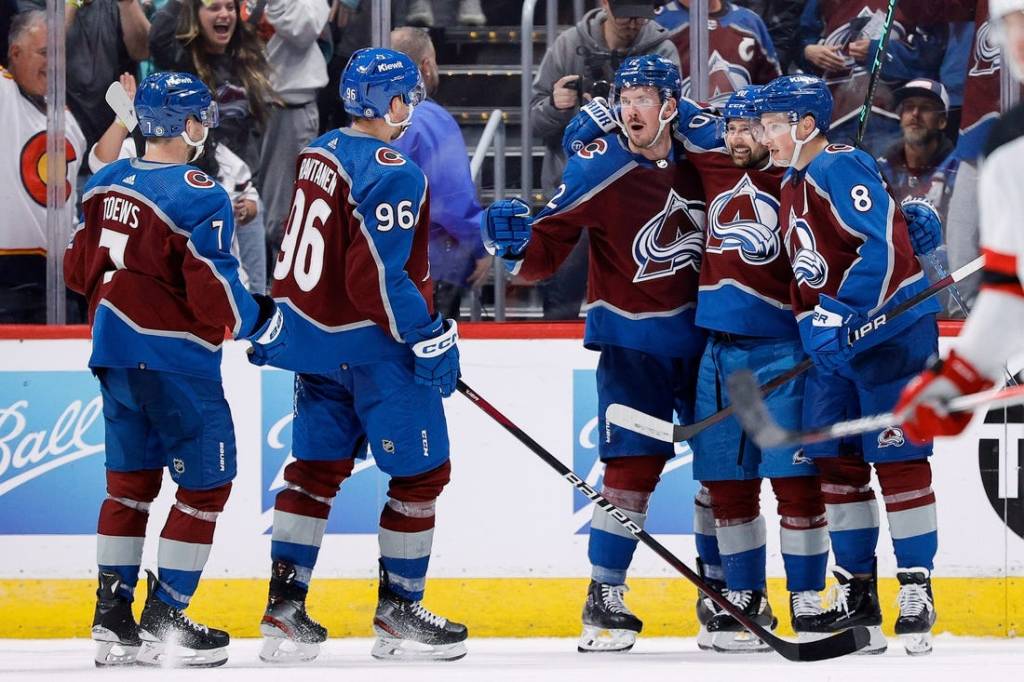 Nov 7, 2023; Denver, Colorado, USA; Colorado Avalanche center Ryan Johansen (12) celebrates his goal with left wing Tomas Tatar (90) and defenseman Cale Makar (8) and right wing Mikko Rantanen (96) and defenseman Devon Toews (7) in the third period against the New Jersey Devils at Ball Arena. Mandatory Credit: Isaiah J. Downing-USA TODAY Sports