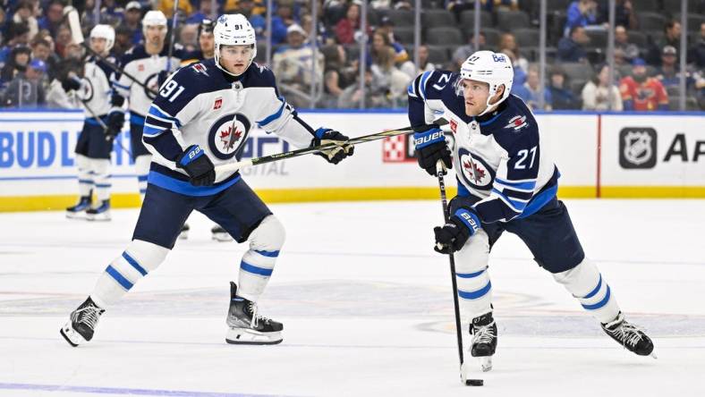 Nov 7, 2023; St. Louis, Missouri, USA;  Winnipeg Jets left wing Nikolaj Ehlers (27) controls the puck against the St. Louis Blues during the third period at Enterprise Center. Mandatory Credit: Jeff Curry-USA TODAY Sports