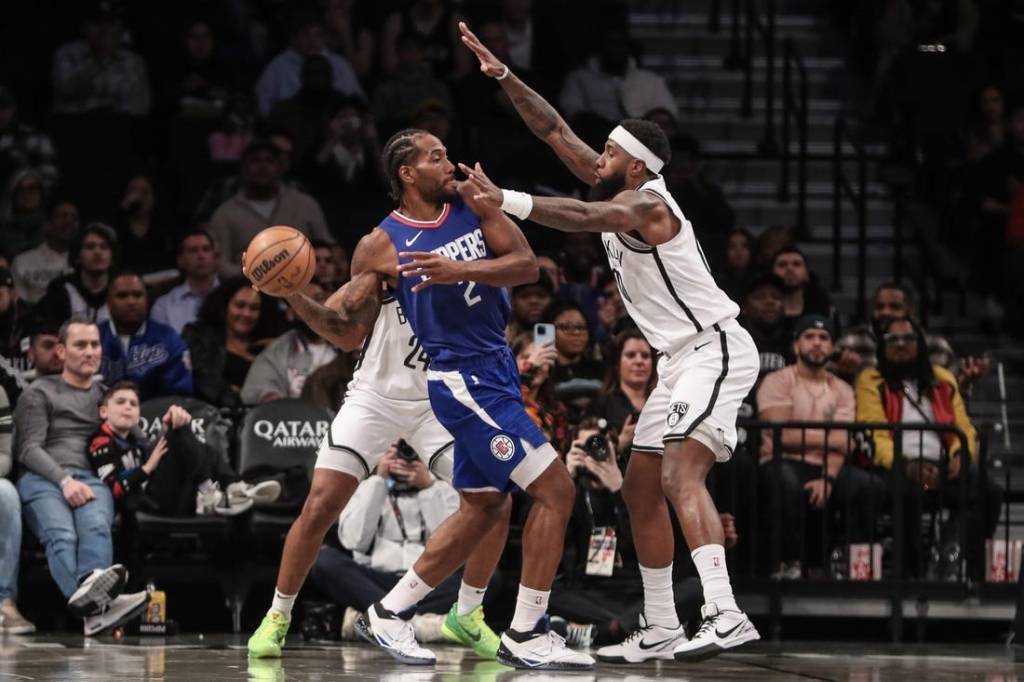 Nov 8, 2023; Brooklyn, New York, USA;  LA Clippers forward Kawhi Leonard (2) looks to make a pass while guarded by Brooklyn Nets forward Royce O'Neale (00) in the first quarter at Barclays Center. Mandatory Credit: Wendell Cruz-USA TODAY Sports