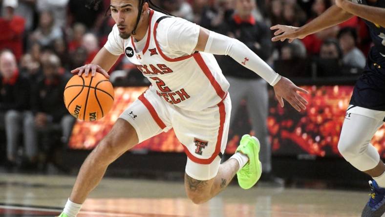 Texas Tech's guard Pop Isaacs (2) dribbles the ball against Texas A&M-Commerce in the first home game of the season, Wednesday, Nov. 8, 2023, at United Supermarkets Arena.