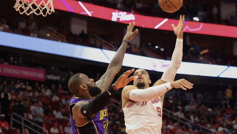 Nov 8, 2023; Houston, Texas, USA; Houston Rockets forward Dillon Brooks (9) shoots against Los Angeles Lakers forward LeBron James (23) in the first quarter at Toyota Center. Mandatory Credit: Thomas Shea-USA TODAY Sports