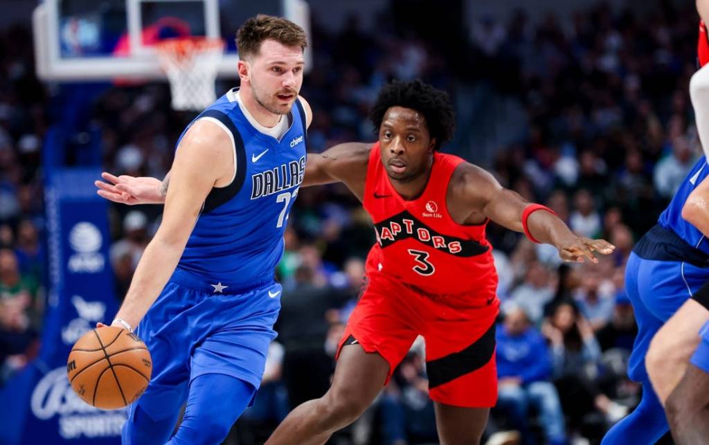 Nov 8, 2023; Dallas, Texas, USA;  Dallas Mavericks guard Luka Doncic (77) dribbles past Toronto Raptors forward O.G. Anunoby (3) during the first quarter at American Airlines Center. Mandatory Credit: Kevin Jairaj-USA TODAY Sports