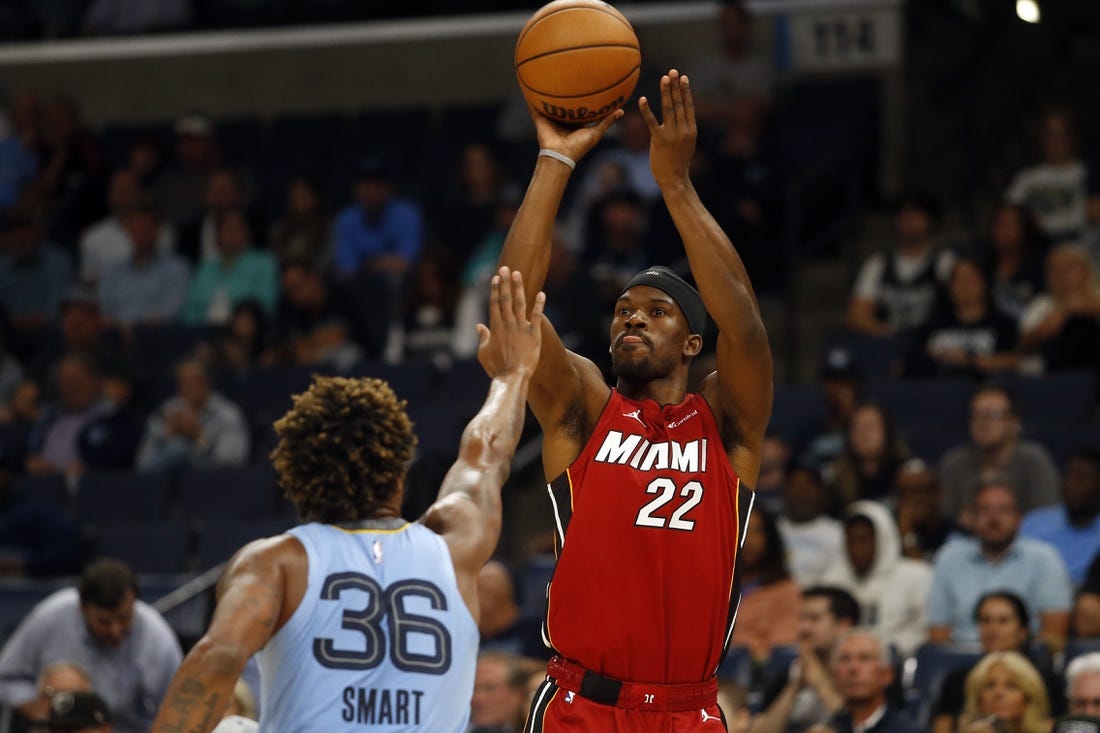 Nov 8, 2023; Memphis, Tennessee, USA; Miami Heat forward Jimmy Butler (22) shoots for three during the first half against the Memphis Grizzlies at FedExForum. Mandatory Credit: Petre Thomas-USA TODAY Sports